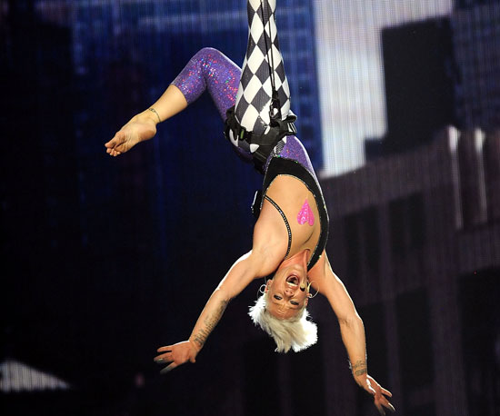 Pink showed off her acrobatic skills during a 2010 performance.
Pink showed off her acrobatic skills during a 2010 performance.