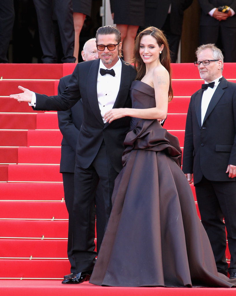 Brad Pitt and Angelina Jolie put on a show for photographers at his May 2011 Cannes Film Festival Tree of Life premiere.
Brad Pitt and Angelina Jolie put on a show for photographers at his May 2011 Cannes Film Festival Tree of Life premiere.