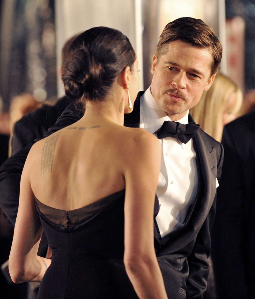 Brad Pitt stole a glimpse of Angelina Jolie at his December 2008 premiere of The Curious Case of Benjamin Button.
Brad Pitt stole a glimpse of Angelina Jolie at his December 2008 premiere of The Curious Case of Benjamin Button.