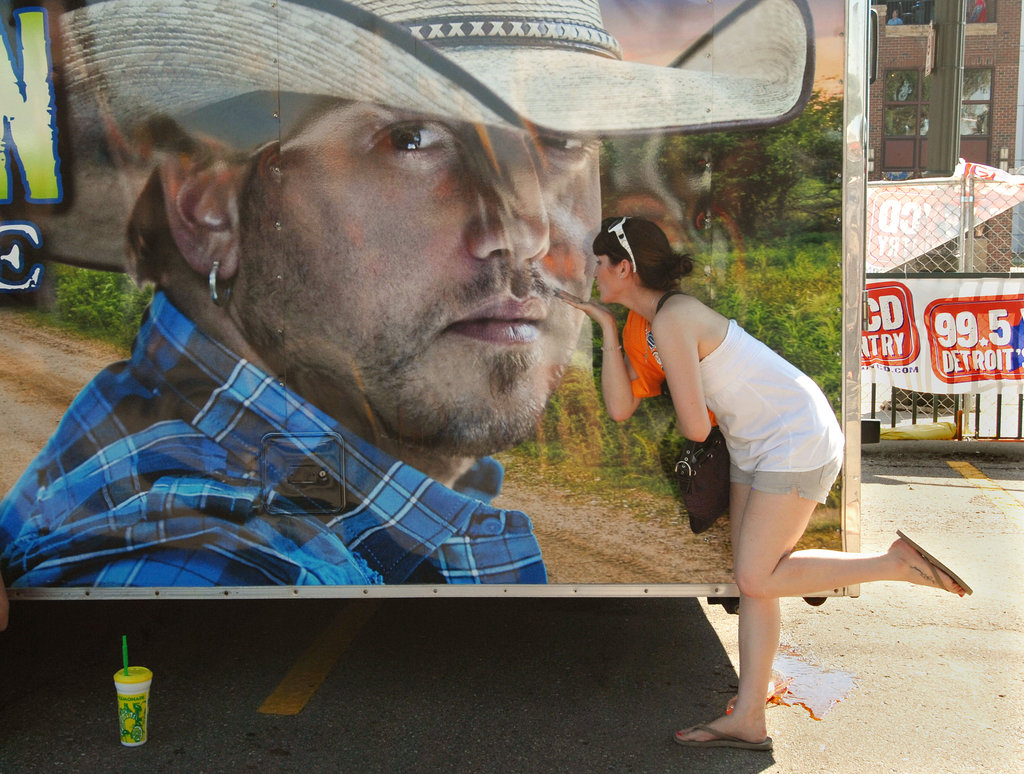 A woman kissed a picture of country singer Jason Aldean at the 2012 Downtown Hoedown at Comerica Park in Detroit.
A woman kissed a picture of country singer Jason Aldean at the 2012 Downtown Hoedown at Comerica Park in Detroit.