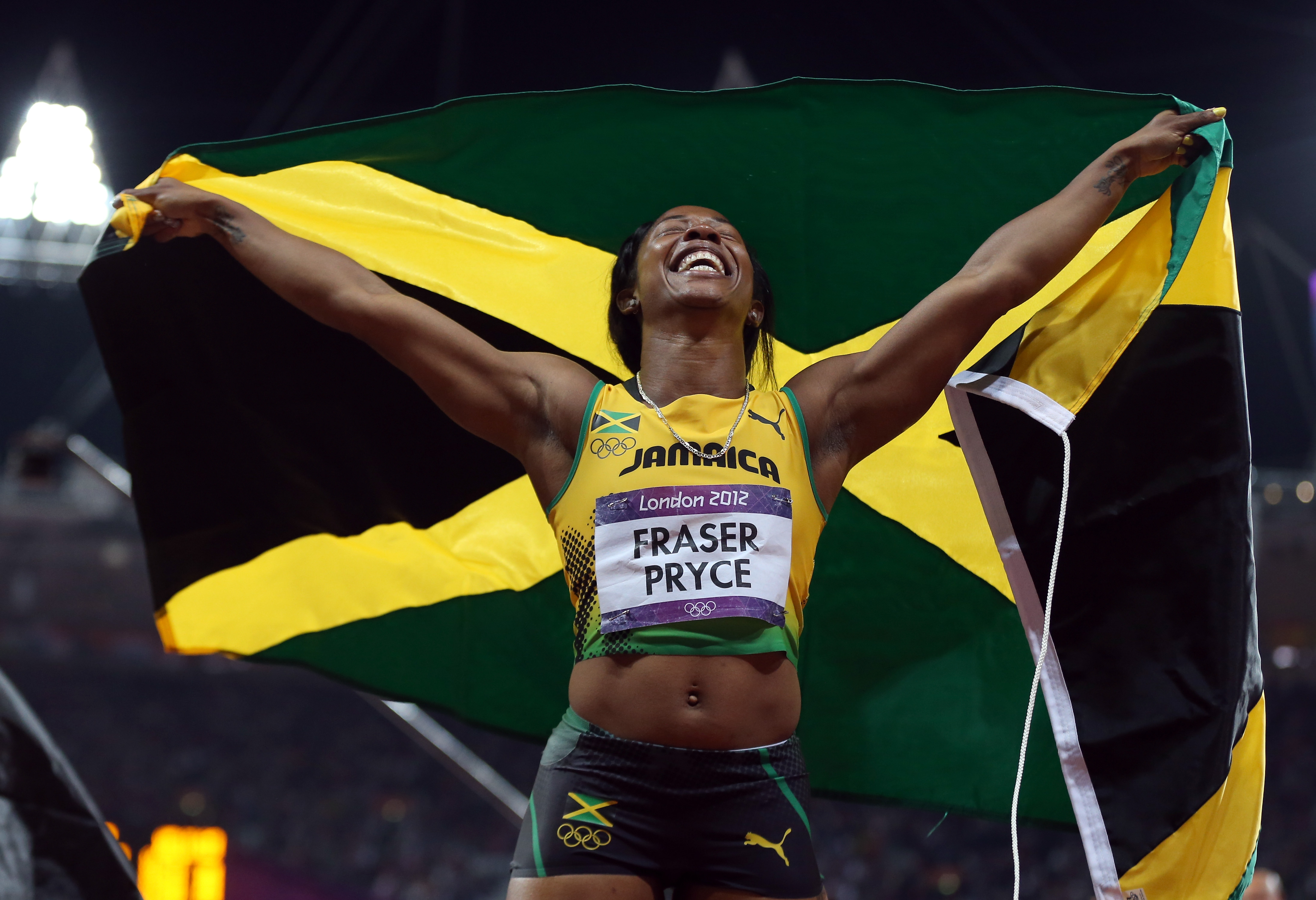 Shelly Ann Fraser Pryce Of Jamaica Ran With Her Flag After Winning