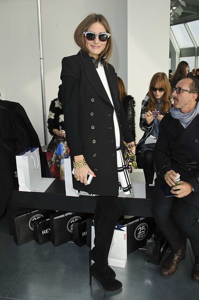 Looking every bit the trendsetter, Olivia posed in a windowpane-plaid Tibi dress, black coat, over-the-knee suede boots, and funky cat-eye shades at Antonio Berardi at LFW.
Looking every bit the trendsetter, Olivia posed in a windowpane-plaid Tibi dress, black coat, over-the-knee suede boots, and funky cat-eye shades at Antonio Berardi at LFW.