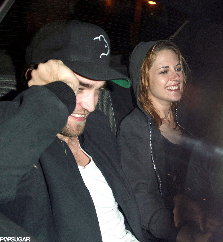 Robert Pattinson and Kristen Stewart shared a laugh and linked arms as they rode in a taxi together after a night out in LA in October 2010.
Robert Pattinson and Kristen Stewart shared a laugh and linked arms as they rode in a taxi together after a night out in LA in October 2010.