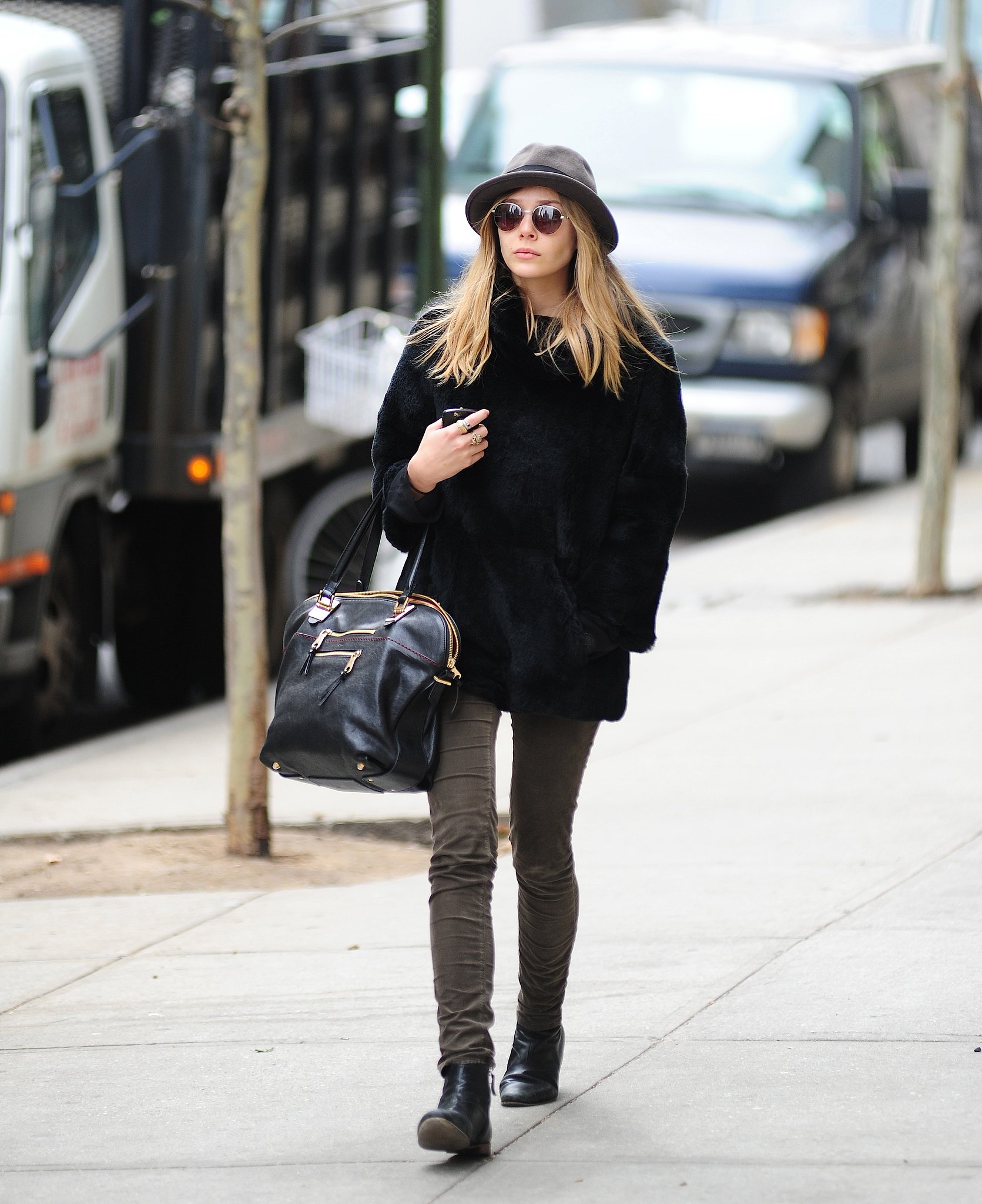 Elizabeth Olsen make this undertated outfit something special by the