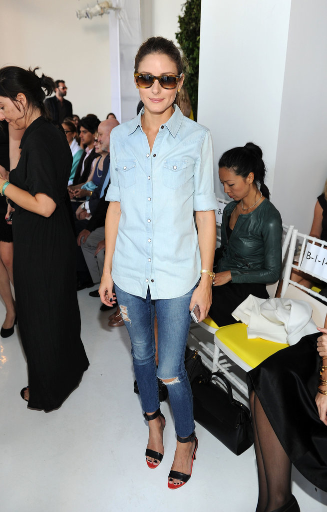 Olivia Palermo worked denim on denim with black ankle-strap sandals and retro sunglasses at Delpozo.
Olivia Palermo worked denim on denim with black ankle-strap sandals and retro sunglasses at Delpozo.