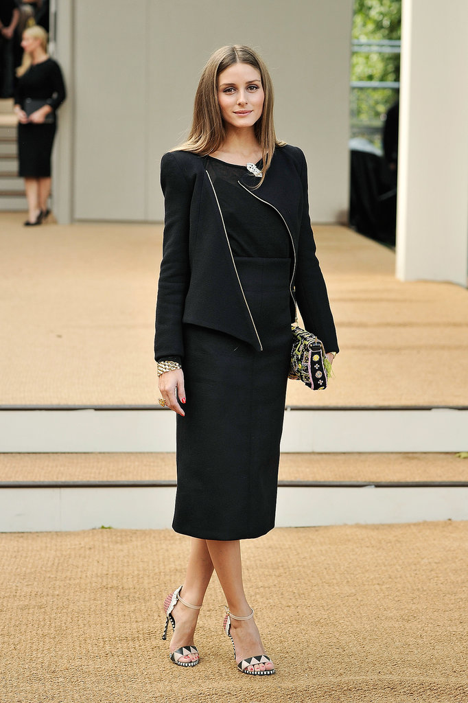 Olivia's conservative look at Burberry Prorsum provided the perfect backdrop against which her colorfully printed heels took center stage.
Olivia's conservative look at Burberry Prorsum provided the perfect backdrop against which her colorfully printed heels took center stage.