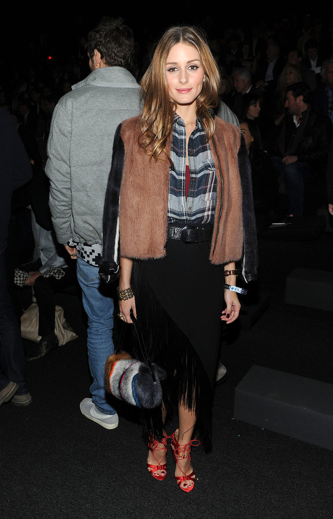 Olivia slipped into a plaid shirt, fringed skirt, and textured topper at the Victoria's Secret Fashion Show.
Olivia slipped into a plaid shirt, fringed skirt, and textured topper at the Victoria's Secret Fashion Show.