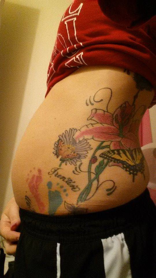 "I actually didn't get my first tattoo until after I had my first two kids — it's their footprints and names. After my divorce and getting my life back together, I actually added to it, and now I am fixing to add to it again with my third baby's footprint and name. There's nothing for me to regret . . . there's a story to it, and my kids love looking at it, and I have no problems showing it. It's my journey through life with my kids, the loss of my daughter's twin through vanishing twin syndrome, my divorce, and getting back on my feet to where I'm at now." — Tricia McCoy
"I actually didn't get my first tattoo until after I had my first two kids — it's their footprints and names. After my divorce and getting my life back together, I actually added to it, and now I am fixing to add to it again with my third baby's footprint and name. There's nothing for me to regret . . . there's a story to it, and my kids love looking at it, and I have no problems showing it. It's my journey through life with my kids, the loss of my daughter's twin through vanishing twin syndrome, my divorce, and getting back on my feet to where I'm at now." — Tricia McCoy