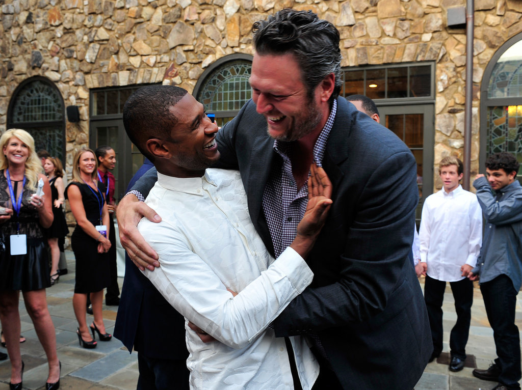 Usher shared a cute bro-ment with his fellow Voice coach Blake Shelton at a fundraiser for his charity in July 2014.
Usher shared a cute bro-ment with his fellow Voice coach Blake Shelton at a fundraiser for his charity in July 2014.