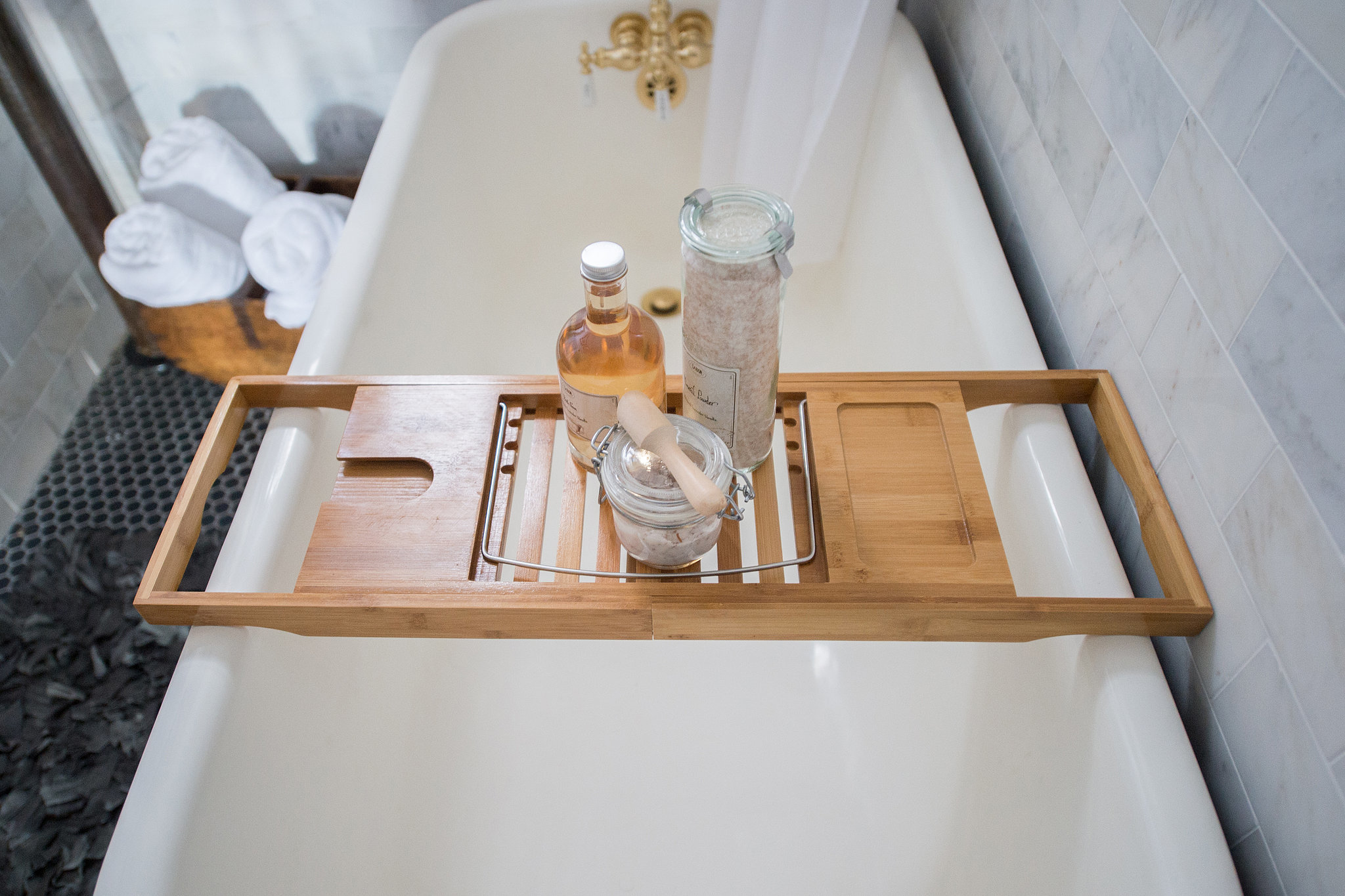 A bath tray makes it easy to keep products (or even a good read) dry