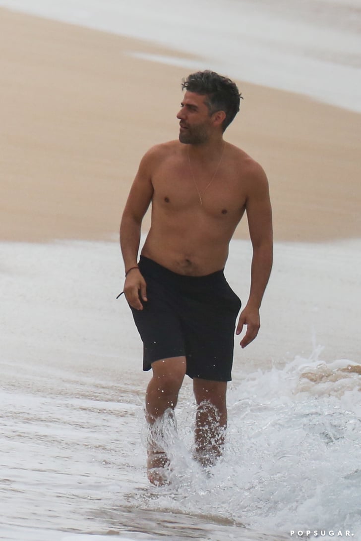 The Pisces with shirtless athletic body on the beach
