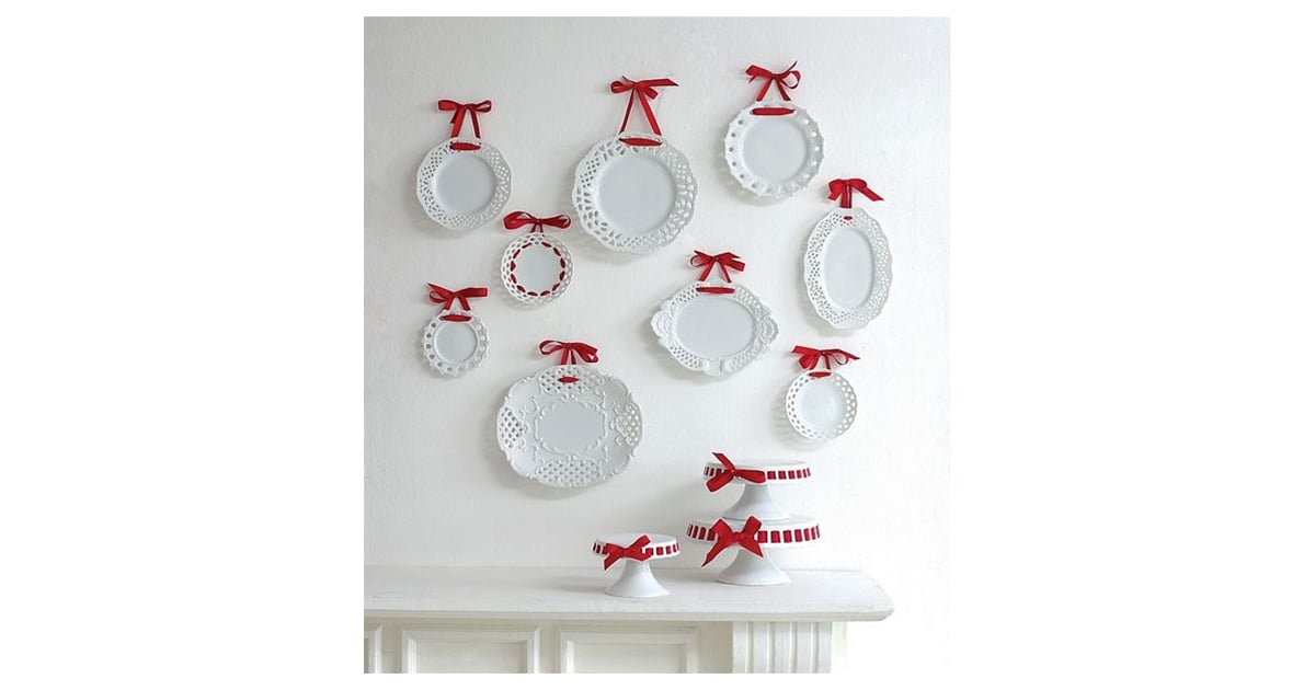 For a pretty touch, hang plates with ribbons. HowTo Decorate on the Cheap With Pretty Plates