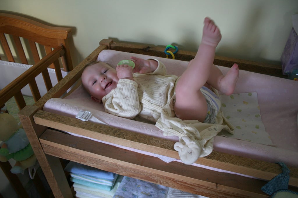Baby girl plays diaper