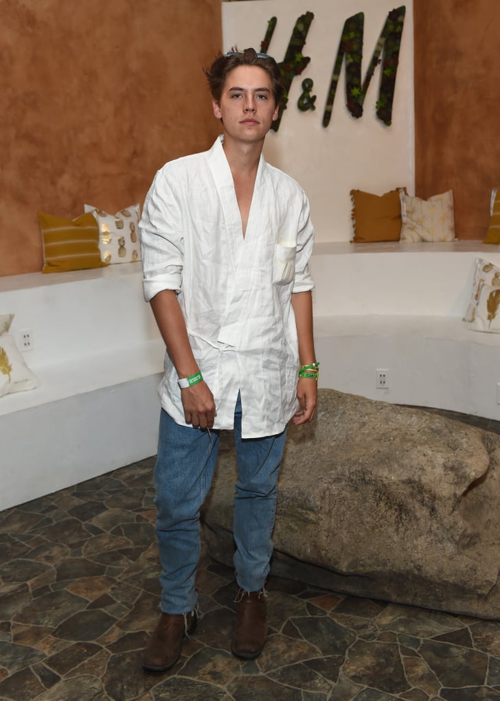Wearing An Asymmetrical White Shirt With Baggy Pants Cole Sprouse My