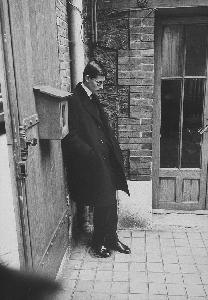1957 Yves Saint Laurent, successor at Dior, standing alone after Christian Dior's funeral. In 1957 Yves Saint Laurent, successor at Dior, standing alone after Christian Dior's funeral. In