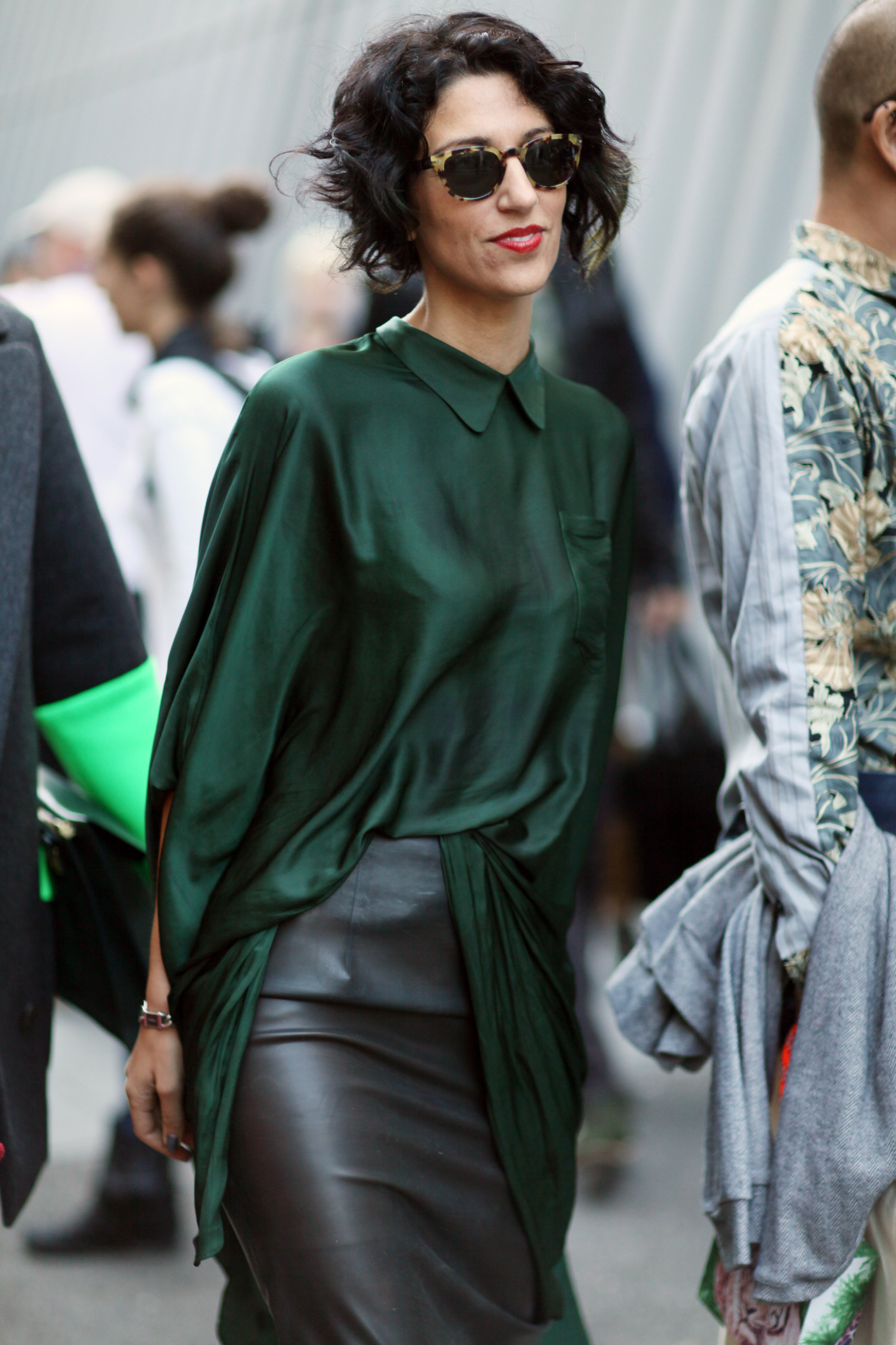 A collared emerald green blouse sweetens the deal on a leather pencil ...