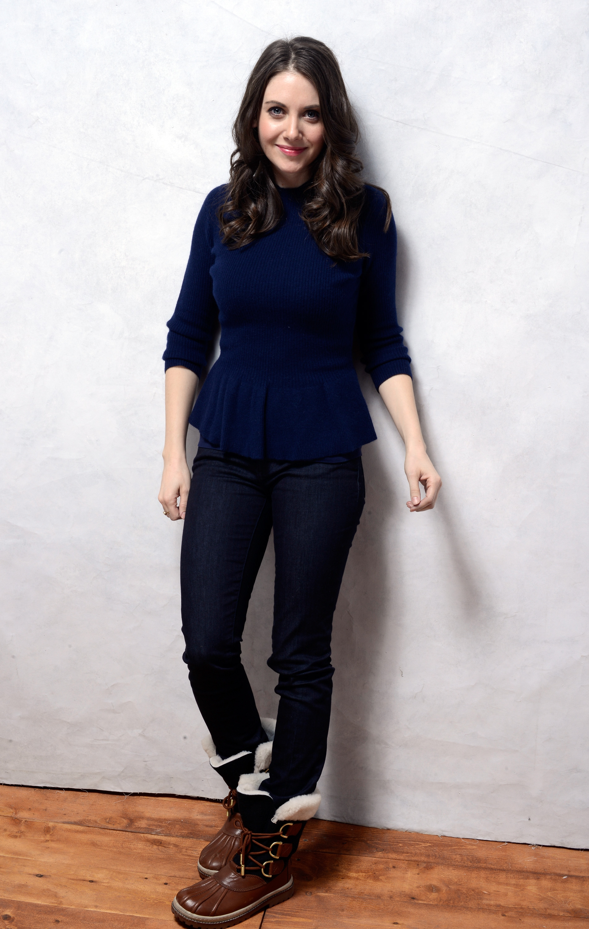 Under her blue belted topper, Alison Brie donned a peplum sweater and ...