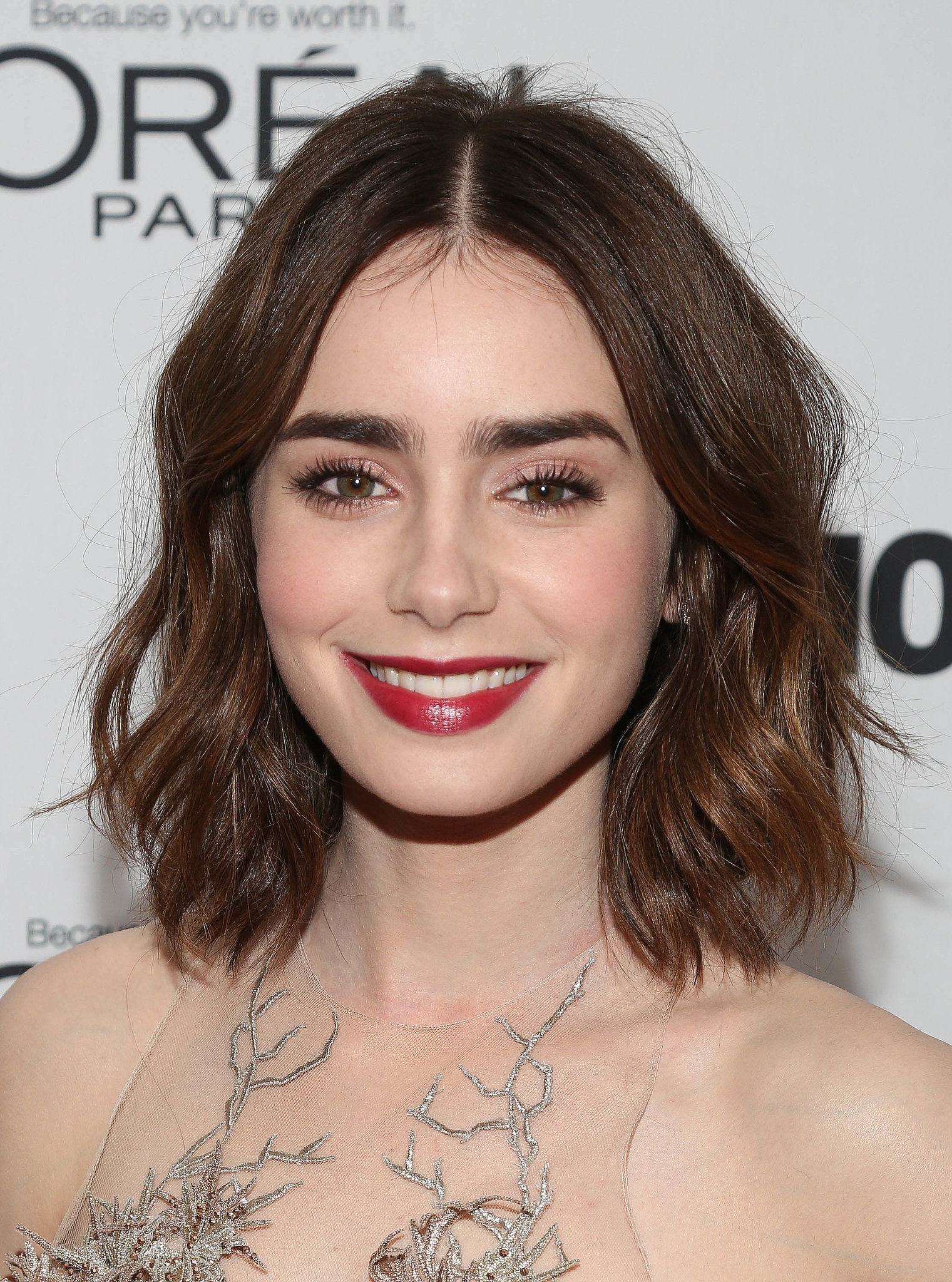 Lily Collins went with shimmering pink shadow on her eyes and a swipe ...