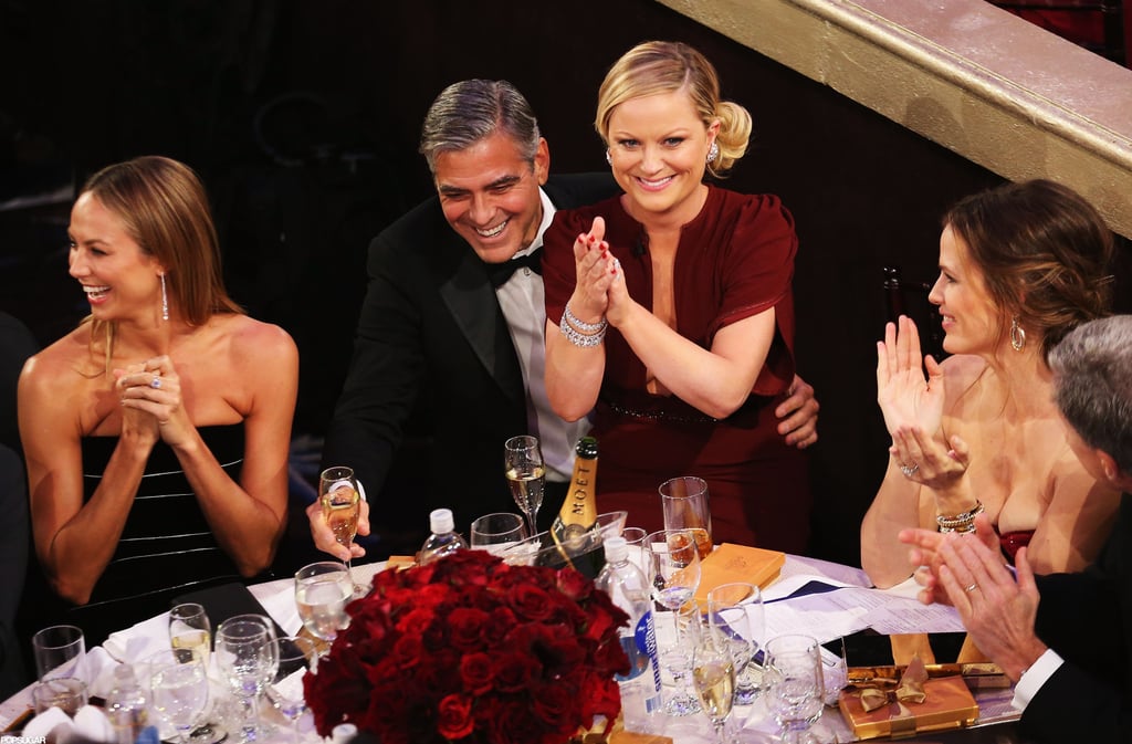 Amy Poehler sat on George Clooney's lap while hosting the 2013 Golden Globes.
