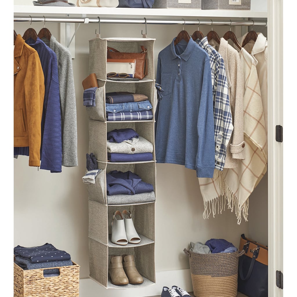 Better Homes & Gardens 6-Shelf Hanging Closet Organizer with 3 Side Pockets ($19)
This closet organizer features six vertical compartments for items like folded clothing, shoes, shirts, and more, plus it has three fold-out side pockets that can house accessories. The best part? It's made of durable fabric that won't sag.