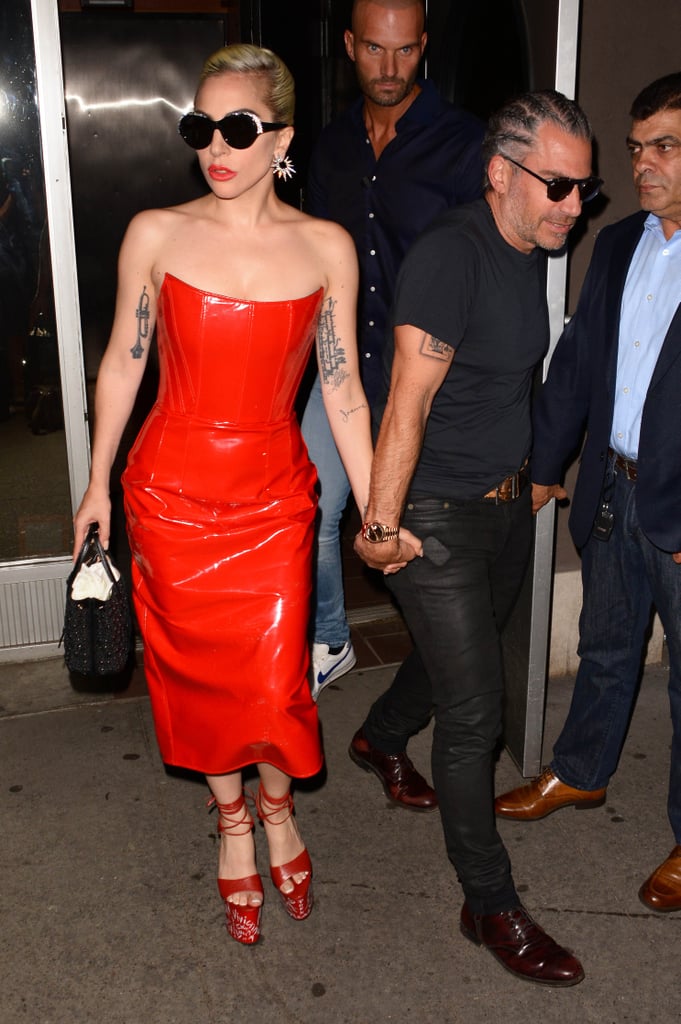 While out with her beau Christian Carino later that evening, Gaga sported a patent Giuseppe Di Morabito dress with sky-high, strappy platforms.