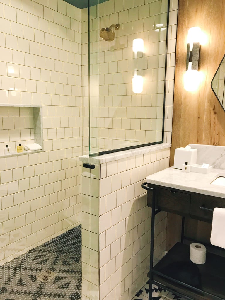The bathroom is also a stylish haven, from the marble vanities to the mosaic floor tiles.