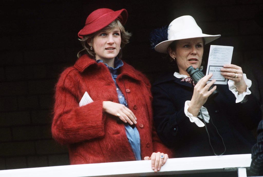 Princess Diana attended the Grand National Race Aintree while she was pregnant with Harry back in 1984. Her outfit of choice? A warm maroon coat with a matching saucer hat over a blue high-collared frock and a dainty clutch tucked under her arm.