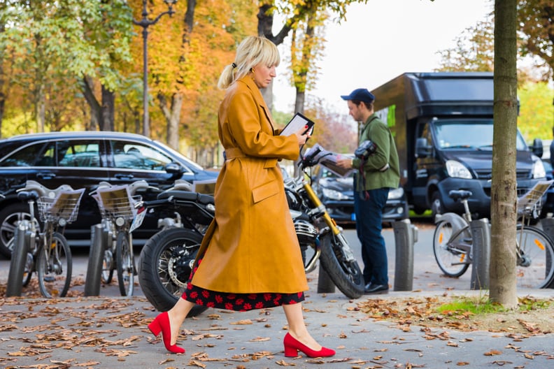 Wear a Mustard Yellow Coat With a Printed Dress and Red Heels