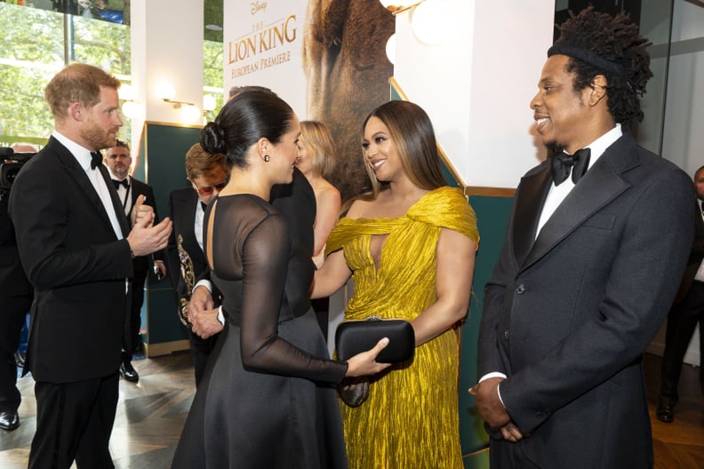 TOPSHOT - Britain's Prince Harry, Duke of Sussex (L) and Britain's Meghan, Duchess of Sussex (2nd L) meets cast and crew, including US singer-songwriter Beyoncé (C) and her husband, US rapper Jay-Z (R) as they attend the European premiere of the film The 
