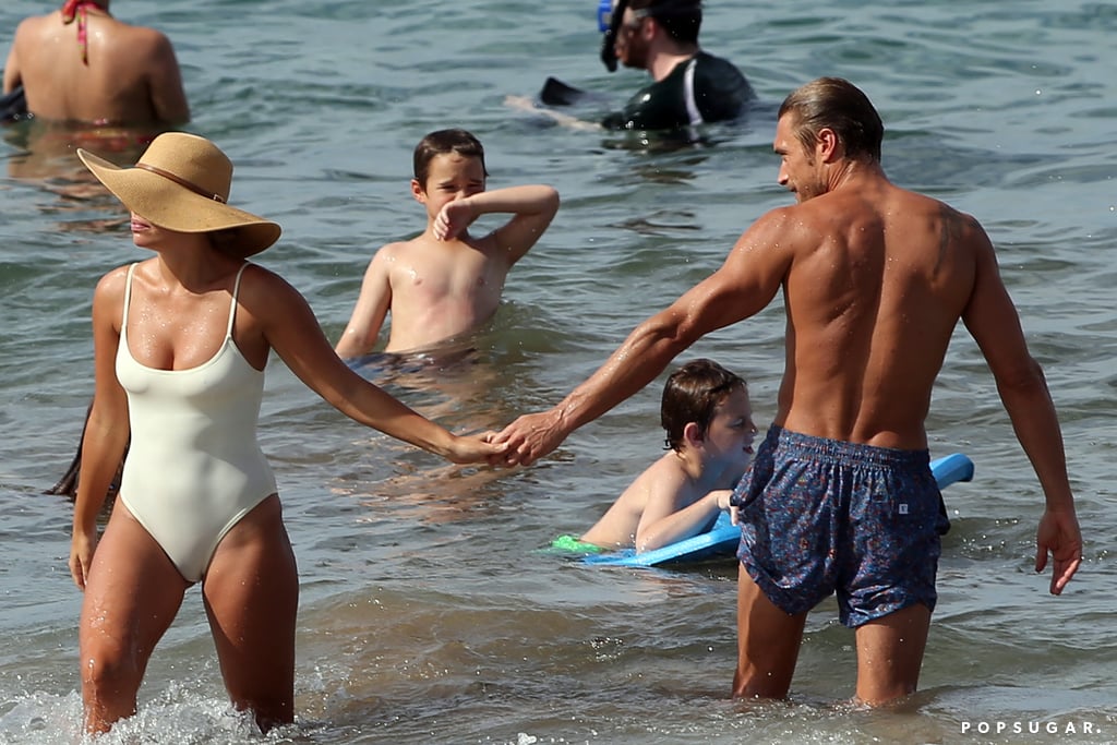 Her suit hugged her curves, highlighting her toned beach bod.
