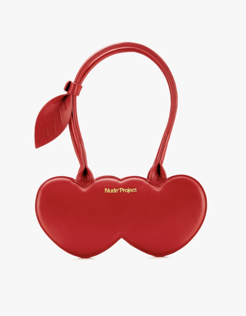 Nude Project Cherry Leather Bag ($189)
Red has long been associated with seduction and love, and the film's repeated use of the color shows that it's time to wield it in your spring 2026 wardrobe. This cherry-shaped bag is a great way to start.