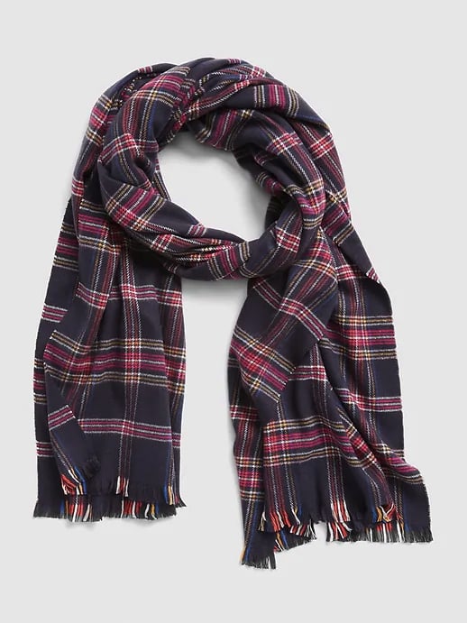Boots and a good coat are just two essentials for staying warm in frigid temps. Winter accessories — like this cozy pattern scarf ($30) — are key, too.