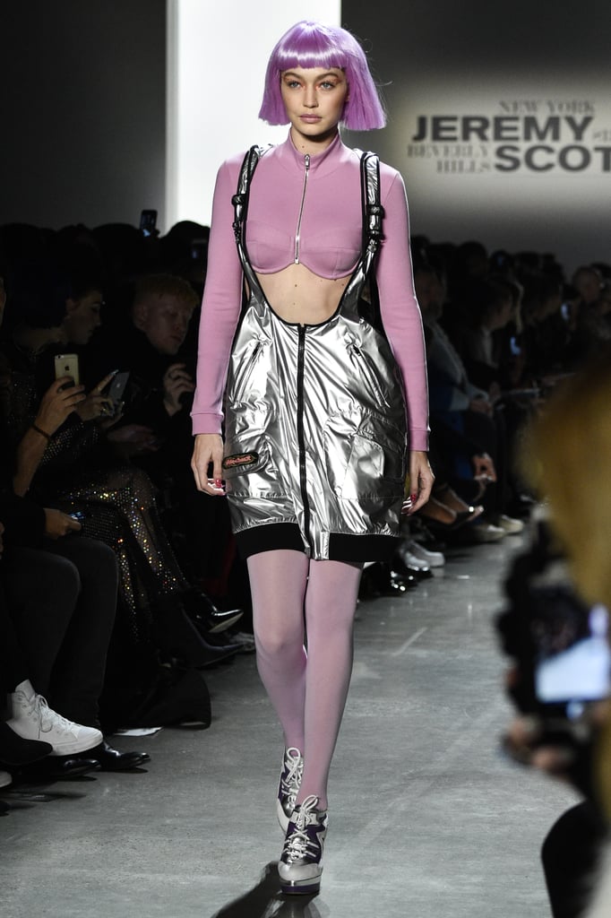 She also wore this long-sleeved, pink crop top with metallic silver overalls and tights. A pink wig completed the look.