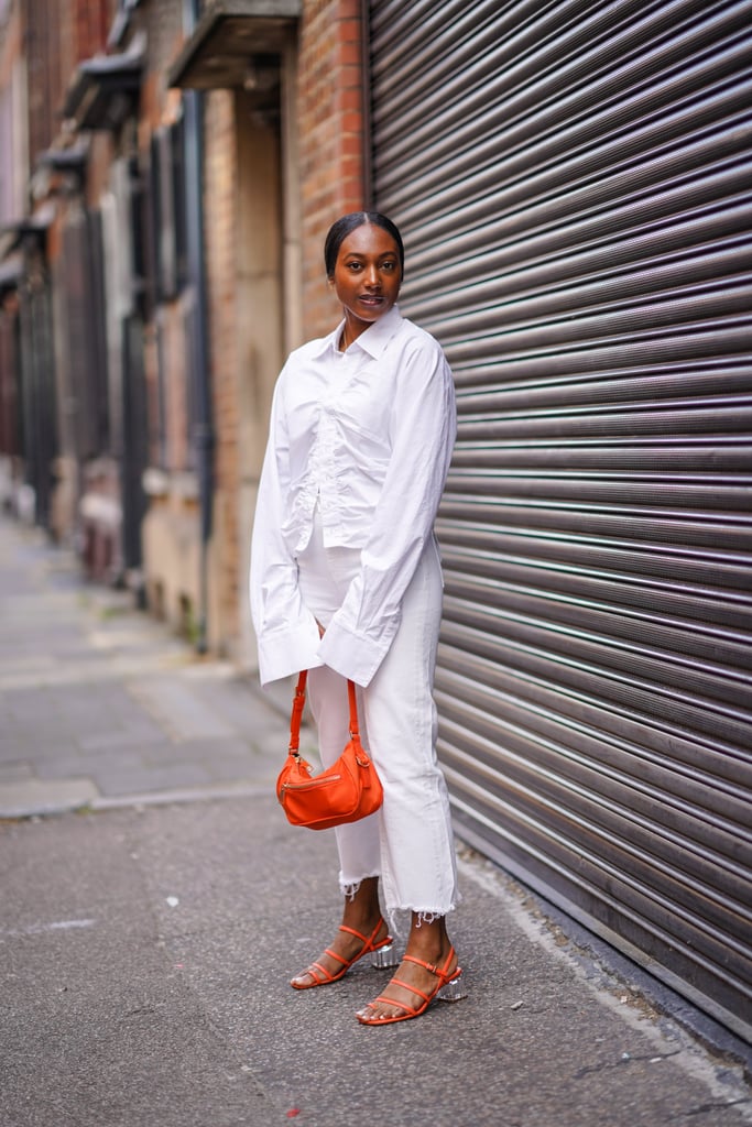 With a White Shirt and Bright Orange Accessories