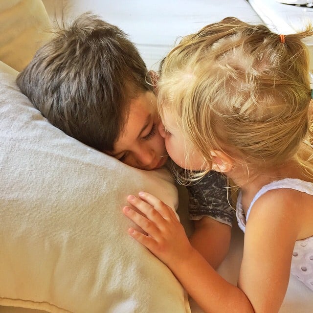 Gisele Bündchen's heart melted as she got this sweet snap of Vivian kissing a sleeping Benjamin.