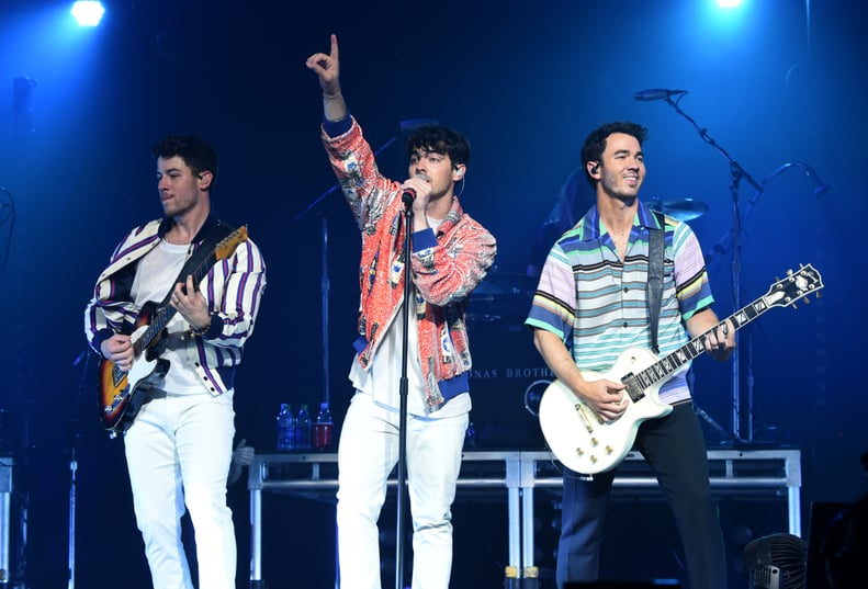 MINNEAPOLIS, MINNESOTA - APRIL 06: (L-R) Nick Jonas, Joe Jonas, and Kevin Jonas of the Jonas Brothers perform onstage at the March Madness Music Series featuring Jonas Brothers presented by Coca-Cola during the NCAA March Madness Music Series at The Armor