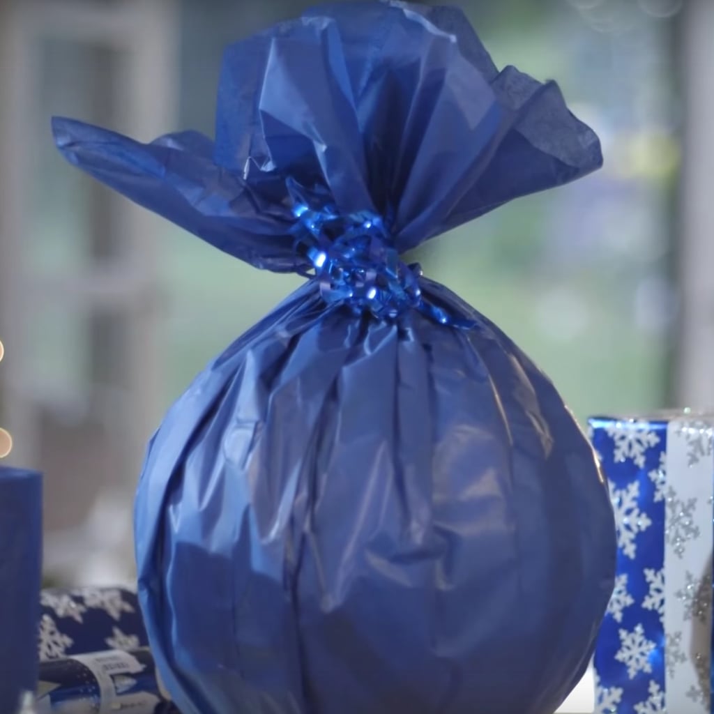 Watch How to Wrap One of the Most Difficult Gifts Ever