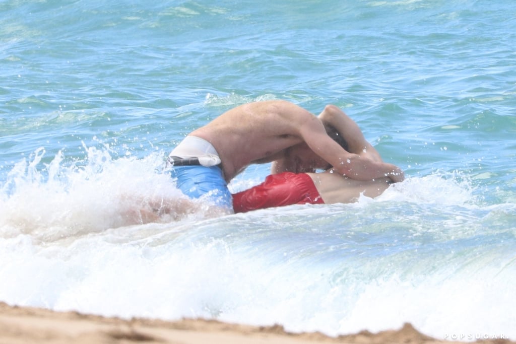 Charlie Hunnam and Garrett Hedlund Wrestle in Hawaii Photos