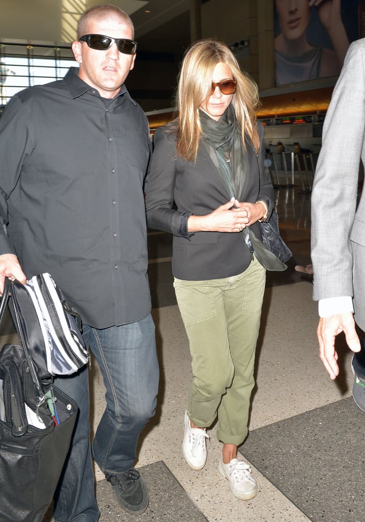 Jennifer Aniston looked cool in cargos and white sneakers as she departed LAX.