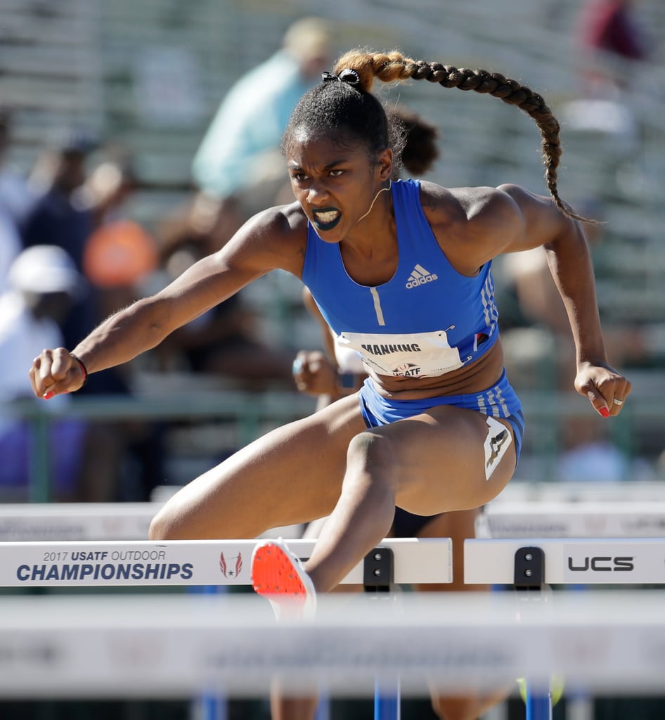 Wearing a long braid, black and white hair bow, and blue lipstick at the 2017 USA Track and Field Championships.