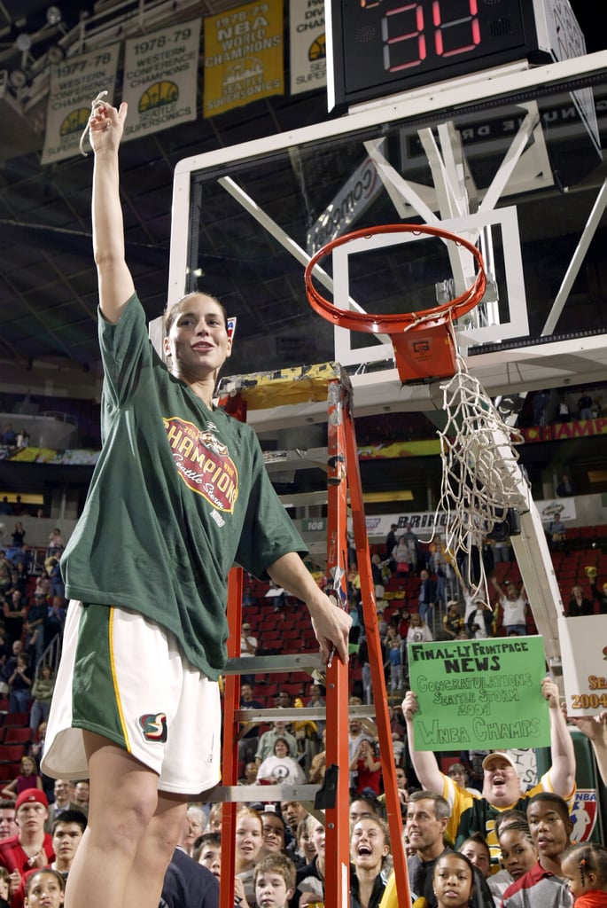Sue Bird Cutting a Piece of Net After Winning the 2004 WNBA Finals With Seattle Storm