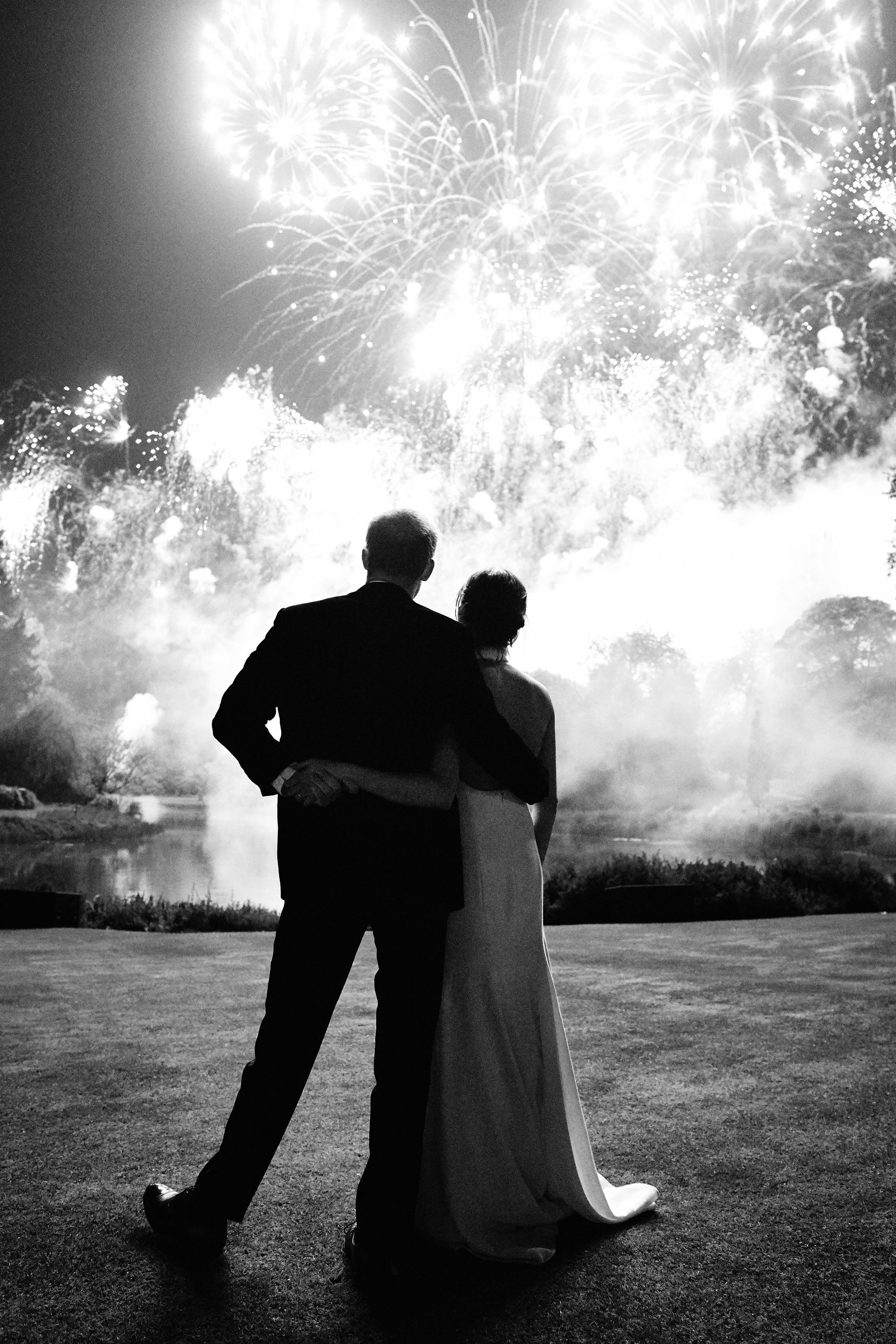 WINDSOR, UNITED KINGDOM – MAY 19: **NO SALES** **NEWS EDITORIAL USE ONLY. NO COMMERCIAL USE**  (This photograph must not be used after 31st December 2019, without prior permission from Kensington Palace.) This photograph taken by Chris Allerton and supplied by Kensington Palace, shows the Prince Harry, Duke of Sussex and Meghan, Duchess of Sussex watching fireworks during their Wedding Reception at Frogmore House on May 19, 2018 in Windsor, United Kingdom. This photo features on their Royal Highnesses' Christmas card this year. (Photo by Chris Allerton/Kensington Palace via Getty Images)NEWS EDITORIAL USE ONLY. NO COMMERCIAL USE (including any use in merchandising, advertising or any other non-editorial use including, for example, calendars, books and supplements). This photograph is provided to you strictly on condition that you will make no charge for the supply, release or publication of it and that these conditions and restrictions will apply (and that you will pass these on) to any organisation to whom you supply it. All other requests for use should be directed to the Press Office at Kensington Palace in writing. The photograph must include all of the individuals when published.