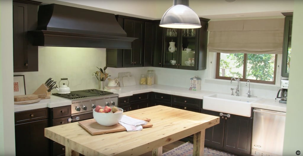 Black cabinets and a reclaimed-wood preparation table make their kitchen the perfect mix of rustic and modern. Black cabinets and a reclaimed-wood preparation table make their kitchen the perfect mix of rustic and modern.