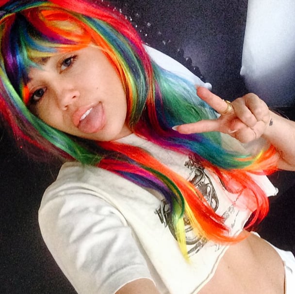 She Tries on Rainbow Wigs . . . and Takes Another Selfie.