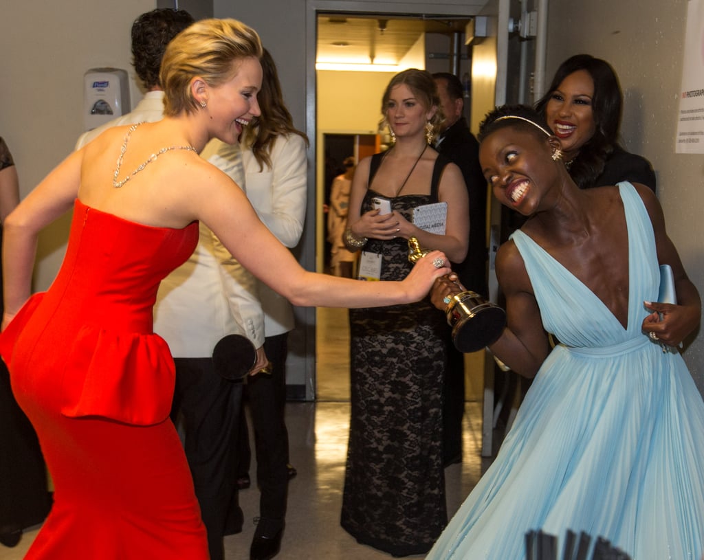 Jennifer Lawrence and Lupita Nyong'o — who were nominated together in the best supporting actress category at this year's Academy Awards — staged an adorable fight over the trophy.