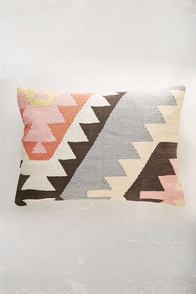 Kilim pillows can easily creep into the triple digits, but this pretty pastel version ($59) makes it easy to update a sofa or bed for Spring.  
— AE