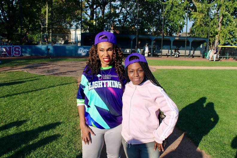 Kiana Glanton with her daughter on the practice field.