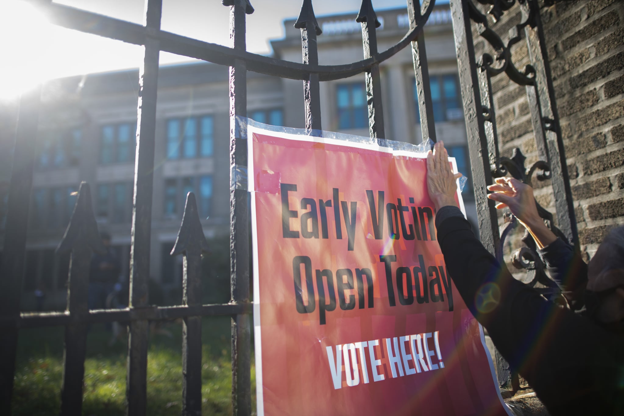 PHILADELPHIA, PA - OCTOBER 17:  A volunteer affixes a sign stating 