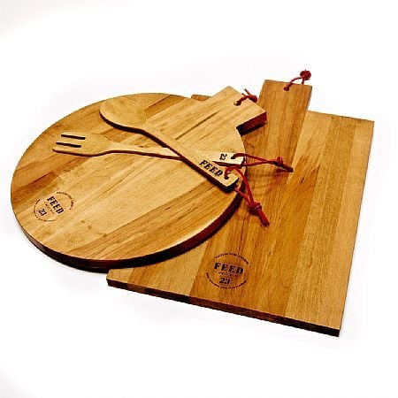 "FEED is celebrating their fifth anniversary this year, and I've been stocking up on these wooden cutting boards ($49) and wine bags ($22) to give as hostess gifts and fight world hunger."