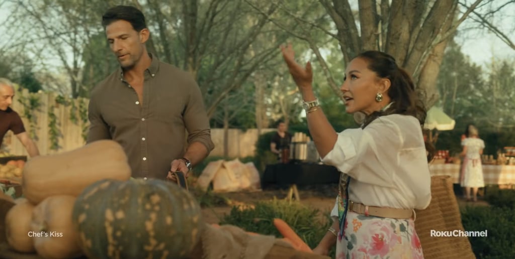 A crisp white button-down, floral skirt, and silk scarf strike the perfect balance between polished and relaxed in this scene with Lauren and Mason, which showcases the two love birds bickering. The layered accessories give the look dimension, while the florals keep it firmly rooted in romantic, spring-ready territory.
Shop the look: Asos Design Oversized Shirt With Wide Sleeves ($40), Quince Sofia European Leather Skinny Belt ($40), Reformation Layla Midi Skirt ($158)